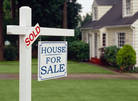 buying-a-green-home-for-sale-sold-sign.jpg